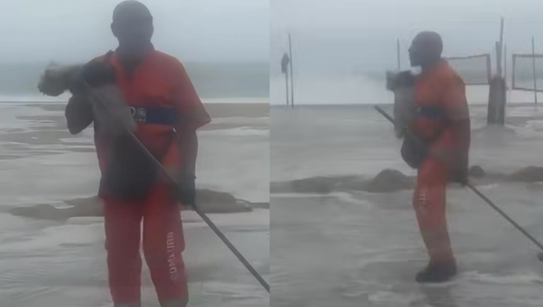 Durante ressaca, gari resgata cachorro que era levado pelo mar em Copacabana
